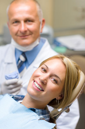 a woman and her dentist in the background