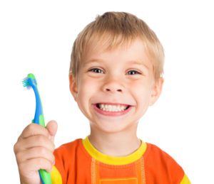 adorable smiling boy holding toothbrush